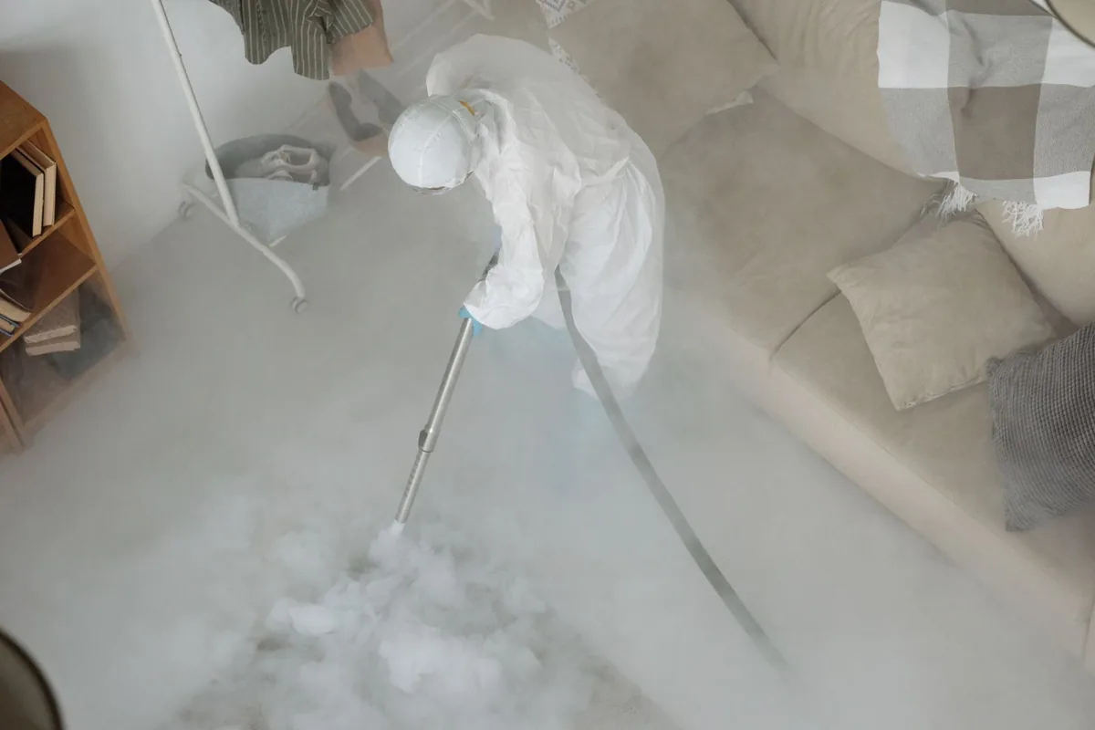 Biohazard cleanup technician in protective equipment, Terryville, NY